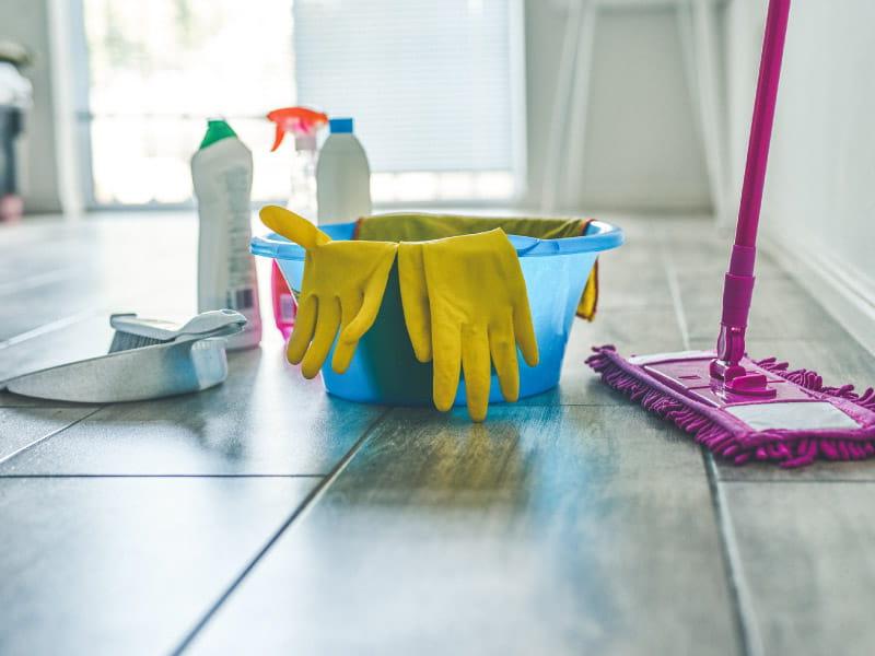 household cleaning products on kitchen floor